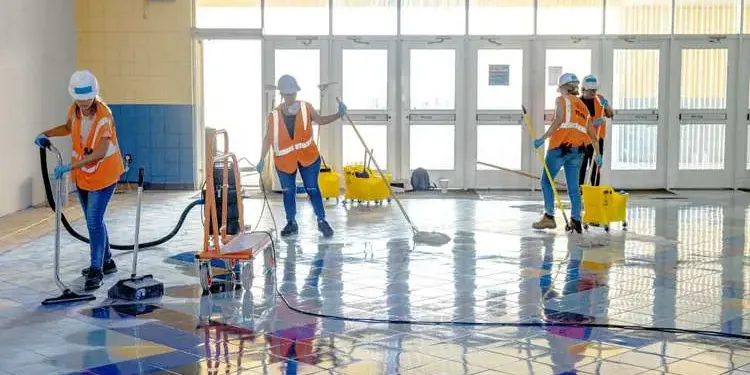 Crew extracting water from a flooded commercial tile floor